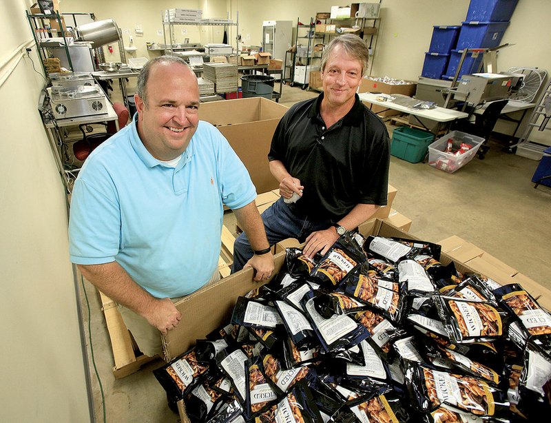 In roughly two calendar years, Wicked Mix president Stan Roberts (left) and owner Brent Bumpers have managed to get the homegrown snack mix into 80 to 100 specialty and gourmet retailers in Arkansas.