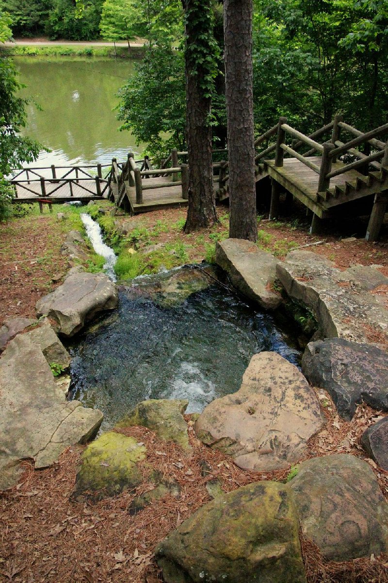 A wishing well and flume overlook Lake Ponder near the visitor center. 
