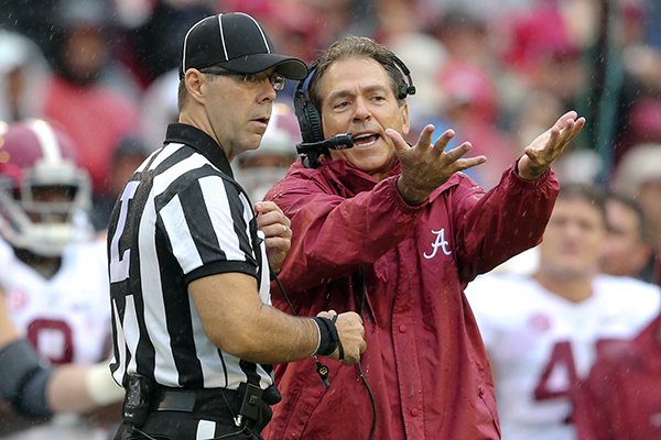 Alabama head coach Nick Saban argues with an official in the first half of an NCAA college football game against Georgia, Saturday, Oct. 3, 2015, in Athens, Ga. (AP Photo/John Bazemore)