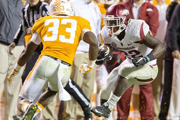 Arkansas freshman running back Rawleigh Williams tries to get around Tennessee senior defensive back LaDarrell McNeil on Saturday, Oct. 3, 2015, against Tennessee at Neyland Stadium in Knoxville, Tenn.