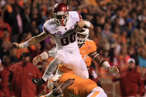 Arkansas wide receiver Drew Morgan leaps over Tennessee defender Kahlil McKenzie for a big gain in the first quarter of the Razorbacks' game against the Volunteers Saturday, Oct. 3, 2015, in Knoxville, Tennessee. The Hogs scored a touchdown on the drive.