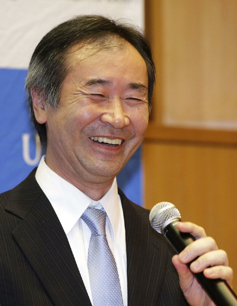 Takaaki Kajita of Japan, director of the Institute for Cosmic Ray Research and professor at the University of Tokyo, speaks Tuesday after learning he won the Nobel Prize in physics for the discovery of neutrino oscillations. 