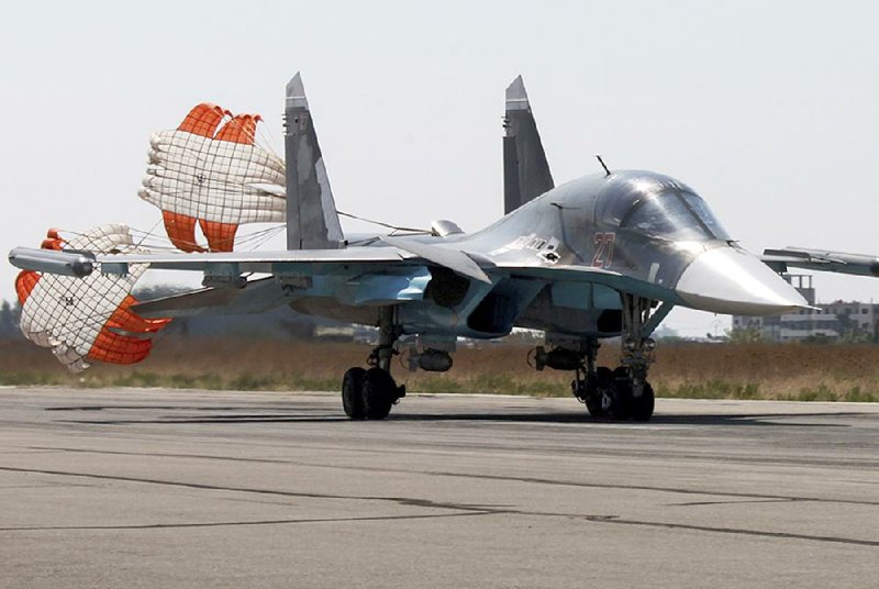 A Russian Su-34 warplane lands at an air base Tuesday in Syria after a bombing mission. U.S. military officials said Tuesday that Russia has agreed to more talks on ensuring the two countries’ aircraft don’t interfere with each other over Syria, but a Russian official called for broader talks on international cooperation in the fight against the Islamic State. 