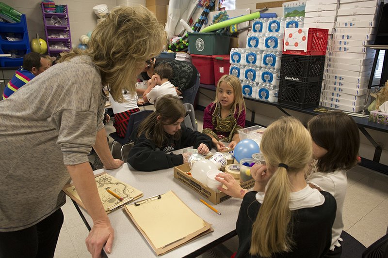 Nanette Nichols, left, talks with students about their ideas for engineering a cannon blaster during McRae Elementary School’s Pirate STEM Day. Clockwise from Nichols are Lakyn, Addison, Jayden and Caitlen. McRae Elementary School officials declined to provide the last names of students pictured, in accordance with school policy.