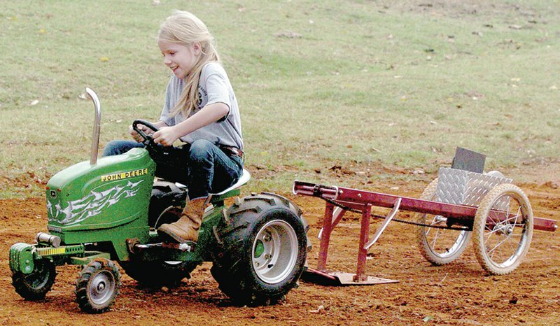 FILE PHOTO Becca Martin had the longest pull of 37-inches at the kiddie tractor pull at the fall 2012 Rustic Relic Show and Pull.