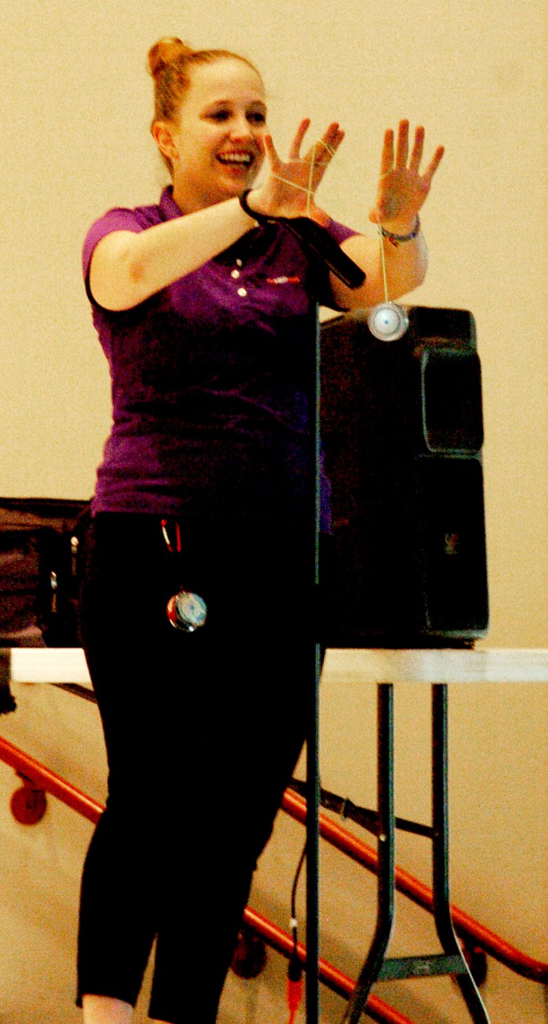 Photo by Mike Eckels Kristie the magician with All For Kidz, Inc., shows off her yo-yo skills by making a spider web during an assembly at Decatur Northside Elementary on Sept. 23.