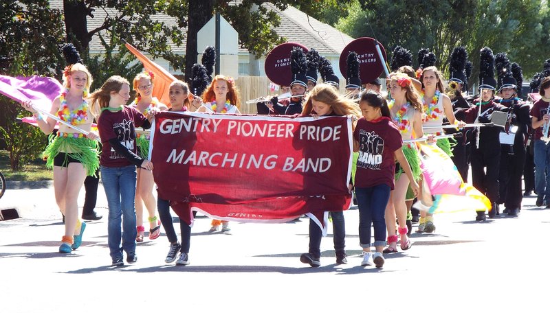 Photo by Randy Moll Gentry Pioneer Pride Marching Band led the stream of floats and cars down Pioneer Lane and to Main Street during the homecoming parade in Gentry on Friday.