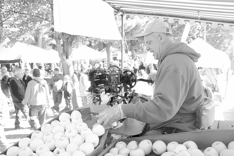 LYNN KUTTER ENTERPRISE-LEADER Willie Leming of Lincoln cored lots of apples during the 40th Annual Arkansas Apple Festival in Lincoln. Volunteers usually core 125-150 bushes of apples every year to give away to visitors at the Festival. See more photos on Page 8A.