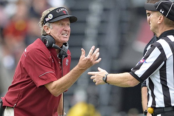South Carolina head coach Steve Spurrier argues a call with an official during the second half of an NCAA college football game against Central Florida, Saturday, Sept. 26, 2015, in Columbia, S.C. South Carolina won 31-14. (AP Photo/Richard Shiro)