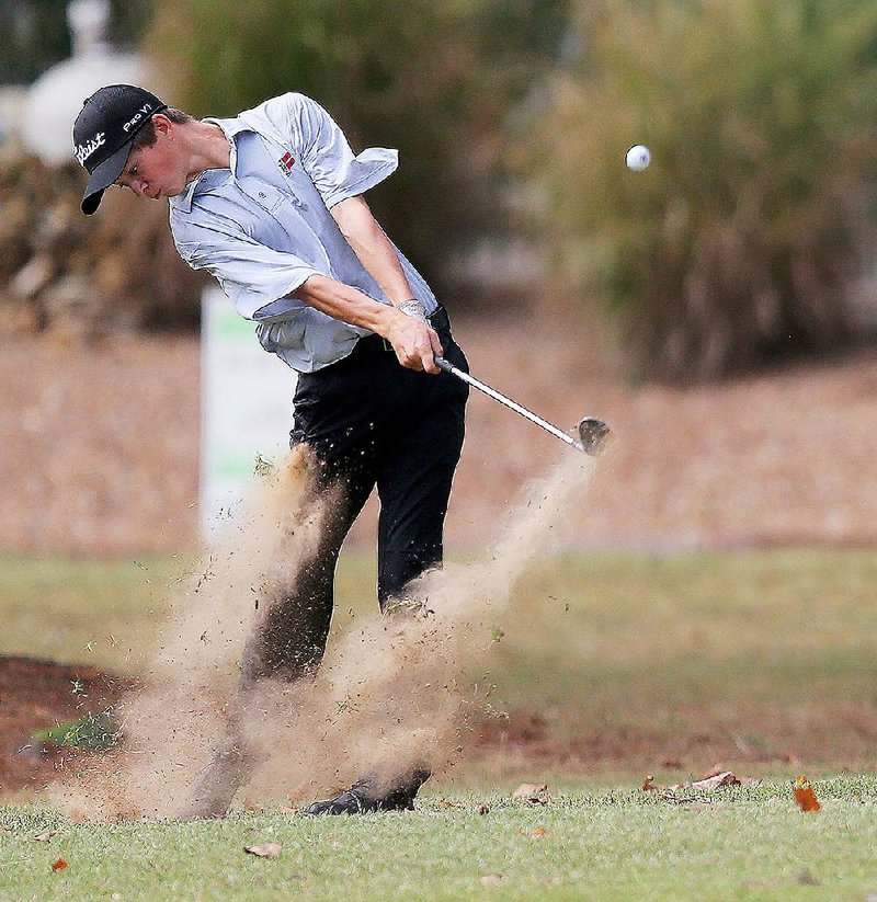 Jonesboro’s Wil Gibson hits from the rough Wednesday during the Class 6A boys golf state tournament at Searcy Country Club. Gibson shot an even-par 71 to win the individual title by 13 strokes, and Jonesboro won the team title by 28 strokes. 