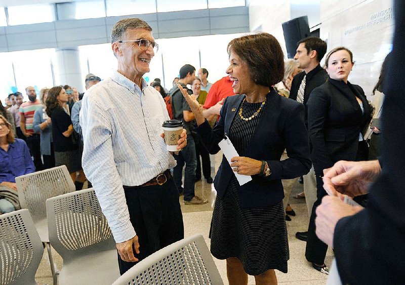 Nobel winner Aziz Sancar, a biochemist at the University of North Carolina, talks with university Chancellor Carol Folt on Wednesday in Chapel Hill. The award was “quite a surprise,” he said. 