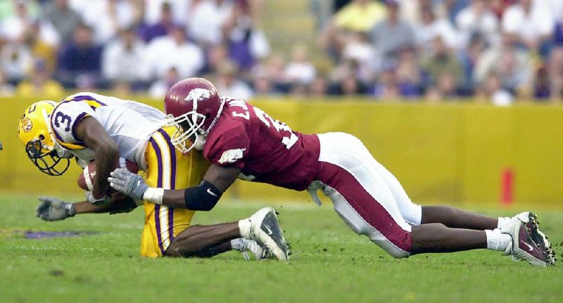 University of Arkansas defensive back Eddie Jackson puts the hit on LSU’s Jerel Myers in this photo from 2001. 