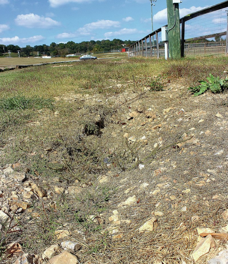 MEGAN DAVIS/MCDONALD COUNTY PRESS A section of the ditch that Eagle Scout Joey Herberger wishes to build a foot bridge over. The rut is located directly between the parking lot and the baseball fields in Anderson.