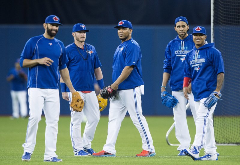 Toronto Blue Jays, from left to right, Jose Bautista, Josh Donaldson, Edwin Encarnacion, David Price, and Marcus Stroman watch batting practice during a team workout at the Rogers Centre in Toronto on Wednesday, Oct. 7, 2015. 