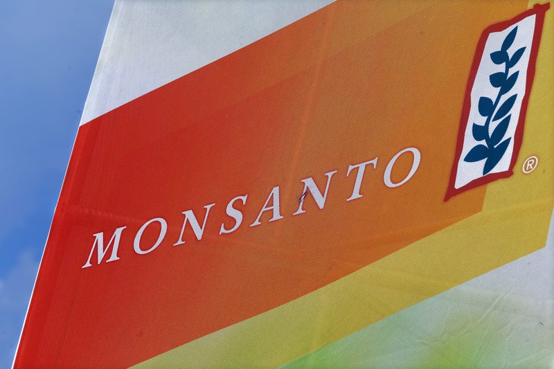 This Monday, Aug. 31, 2015 photo shows the Monsanto logo at the Farm Progress Show in Decatur, Ill. Monsanto reports quarterly financial results on Wednesday, Oct. 7, 2015.
