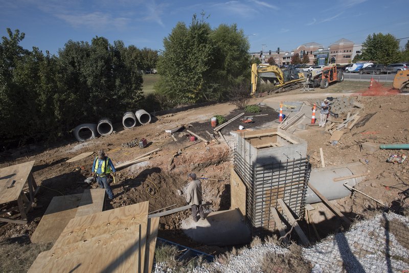 NWA Democrat-Gazette/J.T. WAMPLER Work continues Wednesday on a pedestrian tunnel for the Razorback Greenway under Walton Boulevard in Bentonville. The tunnel should be open in the next couple of weeks.