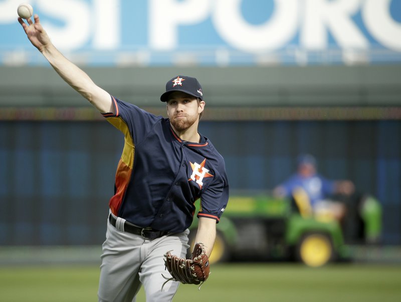 Houston Astros starting pitcher Collin McHugh throws during baseball practice Wednesday, Oct. 7, 2015, in Kansas City, Mo. The Astros face the Kansas City Royals in Game 1 of the ALDS Thursday in Kansas City. 
