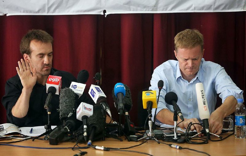 Guilhem Molinie (left) and Christopher Stokes with Doctors Without Borders prepare to talk to reporters Thursday in Kabul, Afghanistan. Stokes said he hoped an investigation of the strike on the Kunduz hospital would “get the facts of what happened, the truth.”