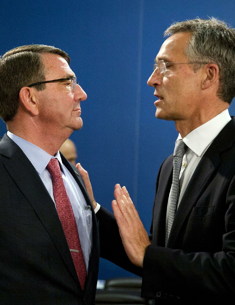 Defense Secretary Ashton Carter (left) meets with NATO Secretary-General Jens Stoltenberg at a meeting of NATO defense ministers Thursday in Brussels. Stoltenberg said NATO was ready to send forces to Turkey, and “any adversary of NATO will know that we are able to deploy.”
