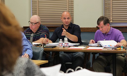 The Sentinel-Record/Richard Rasmussen BUDGET HEARING: Garland County Finance Committee Chairman Matt McKee, center, conducts budget hearings Wednesday at the Garland County Court House alongside fellow justices of the peace Larry Griffin, left, and Ray Owen Jr.