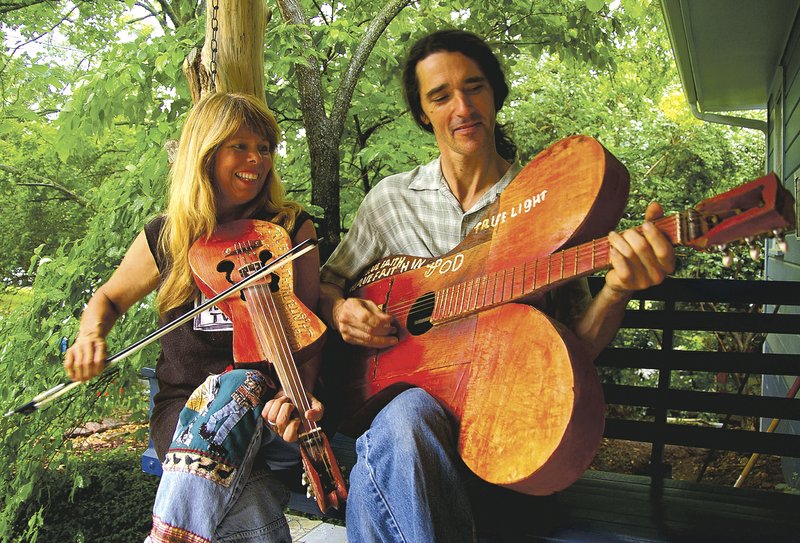 Kelly and Donna Mulhollan make up the duo Still on the Hill, the local Ozark folk group that will perform "Once a River" at a fundraising event tonight at Victory Theater in Rogers.