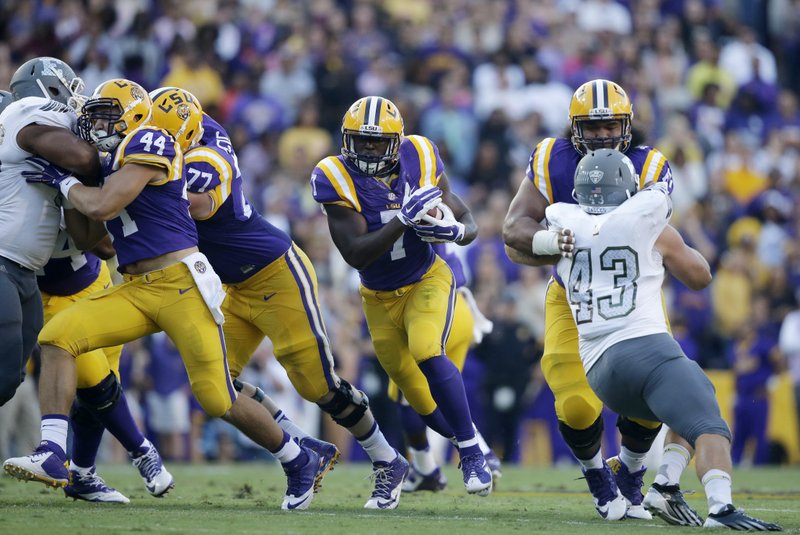  In this Oct. 3, 2015, file photo, LSU running back Leonard Fournette (7) carries past Eastern Michigan linebacker Anthony Zappone (43) in the first half of an NCAA college football game in Baton Rouge, La.