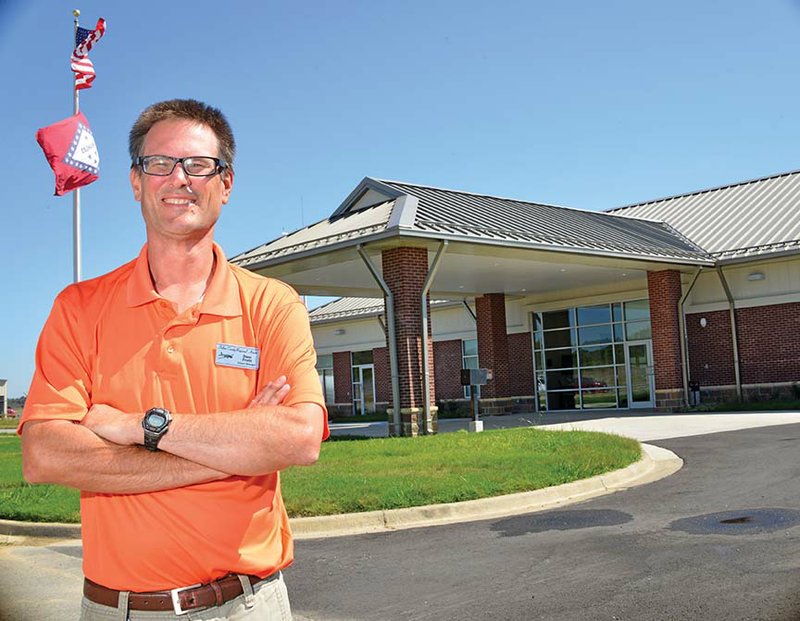 Dane Pruitt, airport manager, stands in front of the newly opened terminal building at the Saline County Regional Airport in Bryant.