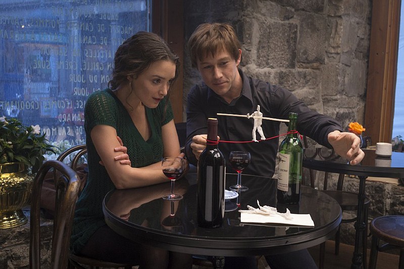 Annie (Charlotte Le Bon) listens as Philippe Petit (Joseph Gordon- Levitt) describes his plan to transverse the air between the World Trade Center’s twin towers in The Walk.
