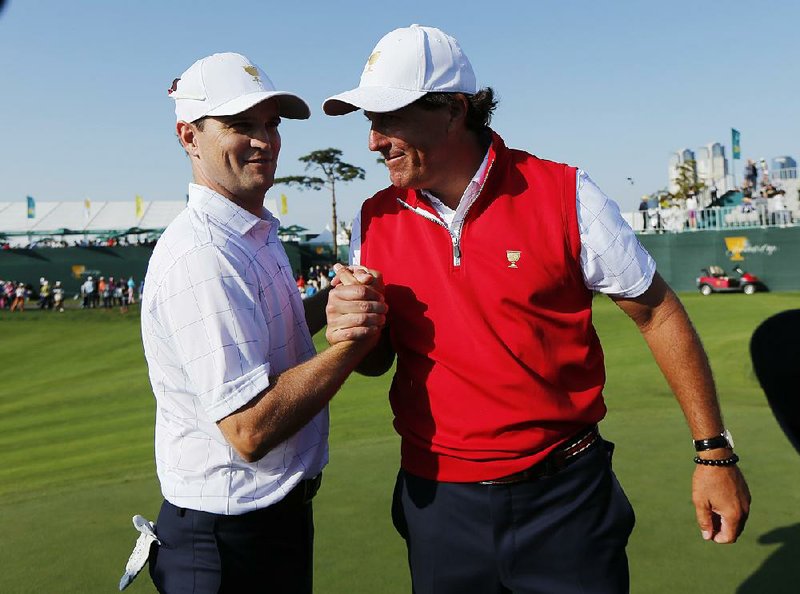 Phil Mickelson (right) wasn’t lacking confidence despite an odd penalty suffered on Day 2 of Presidents Cup competition.
