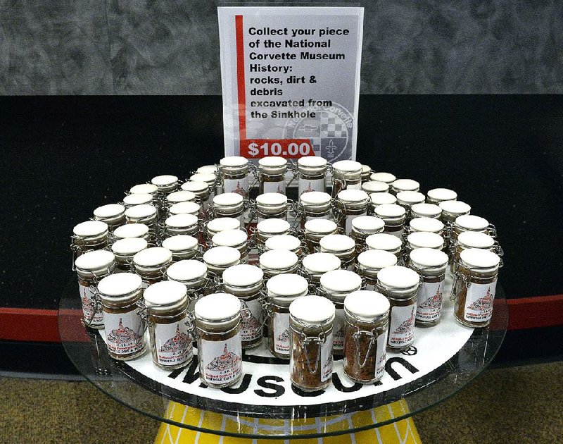 Jars of dirt and rock from the sinkhole that formed under the National Corvette Museum sell for $10 at the museum gift shop in Bowling Green, Ky. 