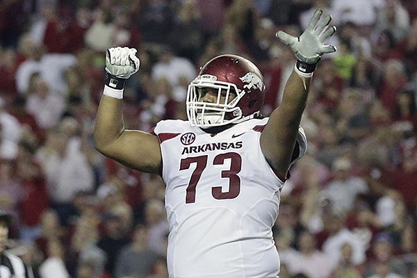 Arkansas offensive lineman Sebastian Tretola (73) celebrates after Arkansas scores against Alabama in the first half of an NCAA college football game, Saturday, Oct. 10, 2015, in Tuscaloosa, Ala. (AP Photo/Brynn Anderson)