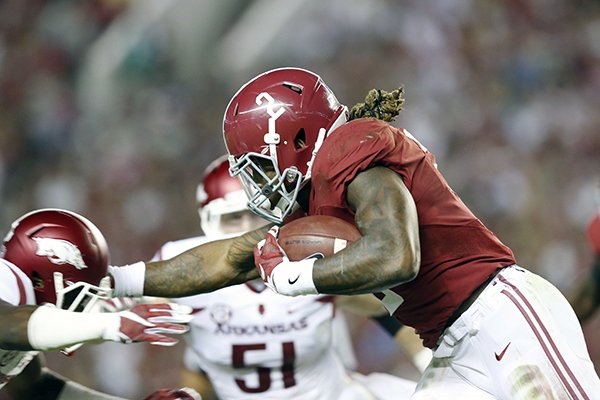 Alabama running back Derrick Henry (2) runs the ball against Arkansas in the first half of an NCAA college football game, Saturday, Oct. 10, 2015, in Tuscaloosa, Ala. (AP Photo/Brynn Anderson)