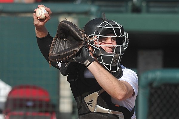 Arkansas catcher Tucker Pennell practices on Wednesday, Jan. 28, 2015, at Baum Stadium in Fayetteville. 