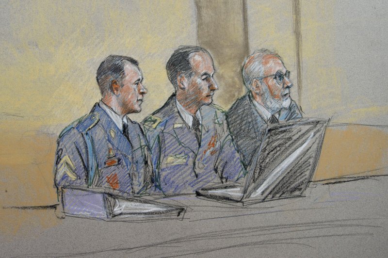 Army Sgt. Bowe Bergdahl, left, defense counsel Lt. Col. Franklin D. Rosenblatt, center, and lead defense counsel Eugene Fidell sit during a preliminary hearing to determine if Sgt. Bergdahl will be court martialed. Bergdahl, who left his post in Afghanistan and was held by the Taliban for five years, is charged with desertion and misbehavior before the enemy. 