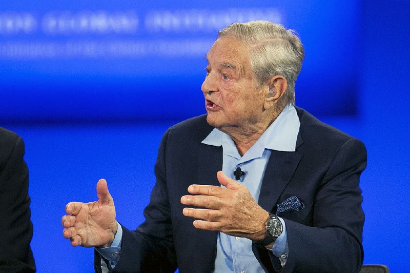 George Soros, Chairman of Soros Fund Management, talks during a television interview for CNN, Sunday, Sept. 27, 2015 at the Clinton Global Initiative in New York. 