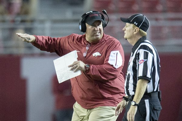 Arkansas head coach Bret Bielema pleads his case to an official following a penalty on a blocked punt during the third quarter against Alabama on Saturday, Oct. 10, 2015, at Bryant-Denny Stadium in Tuscaloosa, Ala.