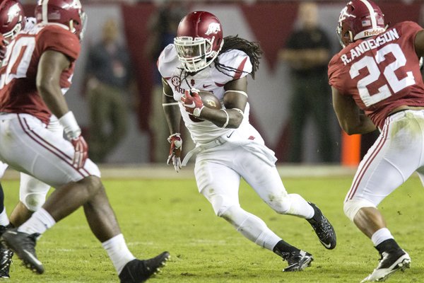 Arkansas running back Alex Collins (3) carries during the third quarter against Alabama on Saturday, Oct. 10, 2015, at Bryant-Denny Stadium in Tuscaloosa, Ala.