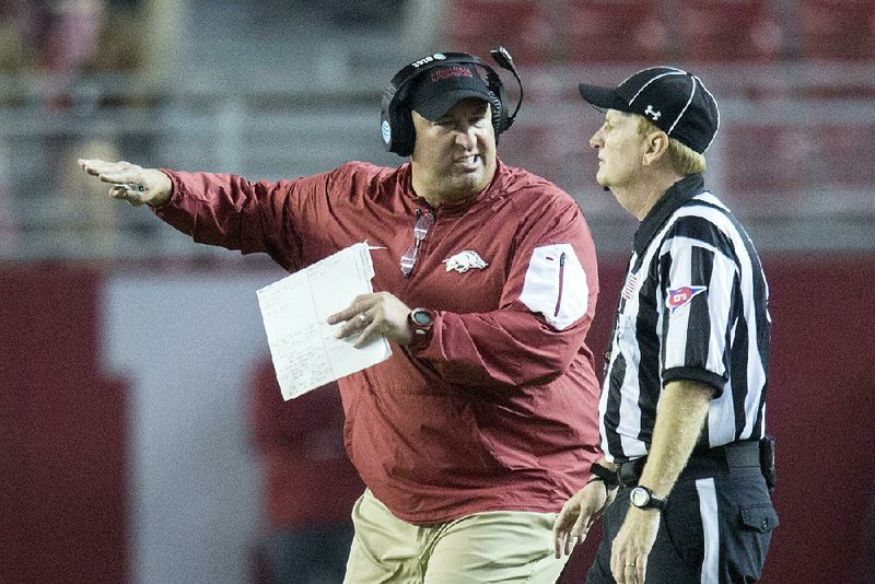 NWA Democrat-Gazette/JASON IVESTER 
Arkansas head coach Bret Bielema pleads his case to an official following a penalty on a blocked punt during the third quarter against Alabama on Saturday, Oct. 10, 2015, at Bryant-Denny Stadium in Tuscaloosa, Ala.