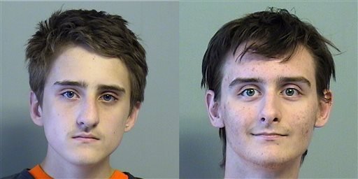 This combination of July 2015 file photos provided by the Tulsa County Jail shows Michael Bever, left, and his brother Robert Beaver.