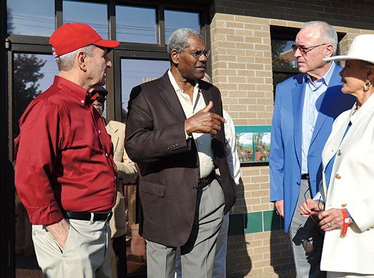 The Sentinel-Record/Mara Kuhn BIG-TIME BOB: Baseball historian Don Duren, left, visits with Hall of Fame pitcher Bob Gibson, Sandy Dean, son of Paul "Daffy" Dean, and Bonnie Holthus during the plaque installation for brothers Daffy and Jay Hanna "Dizzy" Dean, both deceased, on the Hot Springs Baseball Trail Saturday at the intersection of Spring Street and Central Avenue. Gibson, one of the most dominant pitchers in St. Louis Cardinals history, came to the Spa City as the Cardinals and rival Chicago Cubs played their first postseason series against each other.
