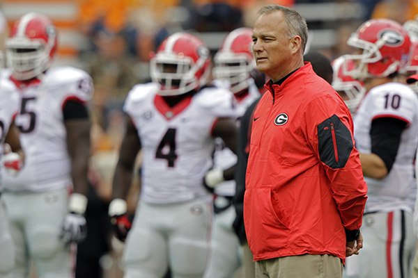 Georgia head coach Mark Richt watches as his team warms up before the start of an NCAA college football game against Tennessee Saturday, Oct. 10, 2015 in Knoxville, Tenn. (AP Photo/Wade Payne)