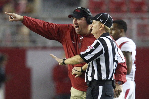 Arkansas coach Bret Bielema talks with an official during a game against Alabama on Saturday, Oct. 10, 2015, at Bryant-Denny Stadium in Tuscaloosa, Ala. 