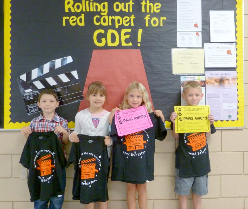 Submitted Photo Nick Douglas (left), Evelyn Bailey, Izzy Mayhew and Braeden Baker, all of Gravette, were recognized as PAWS (&#8220;Pawsitive&#8221; and Wise Student) winners at last week&#8217;s &#8220;Rise and Shine&#8221; assembly at Glenn Duffy Elementary School. They were rewarded with certificates and T-shirts for displaying the character trait of self-control. Zane Banks and Bria Ingram, both of Bella Vista, were not present for the picture.