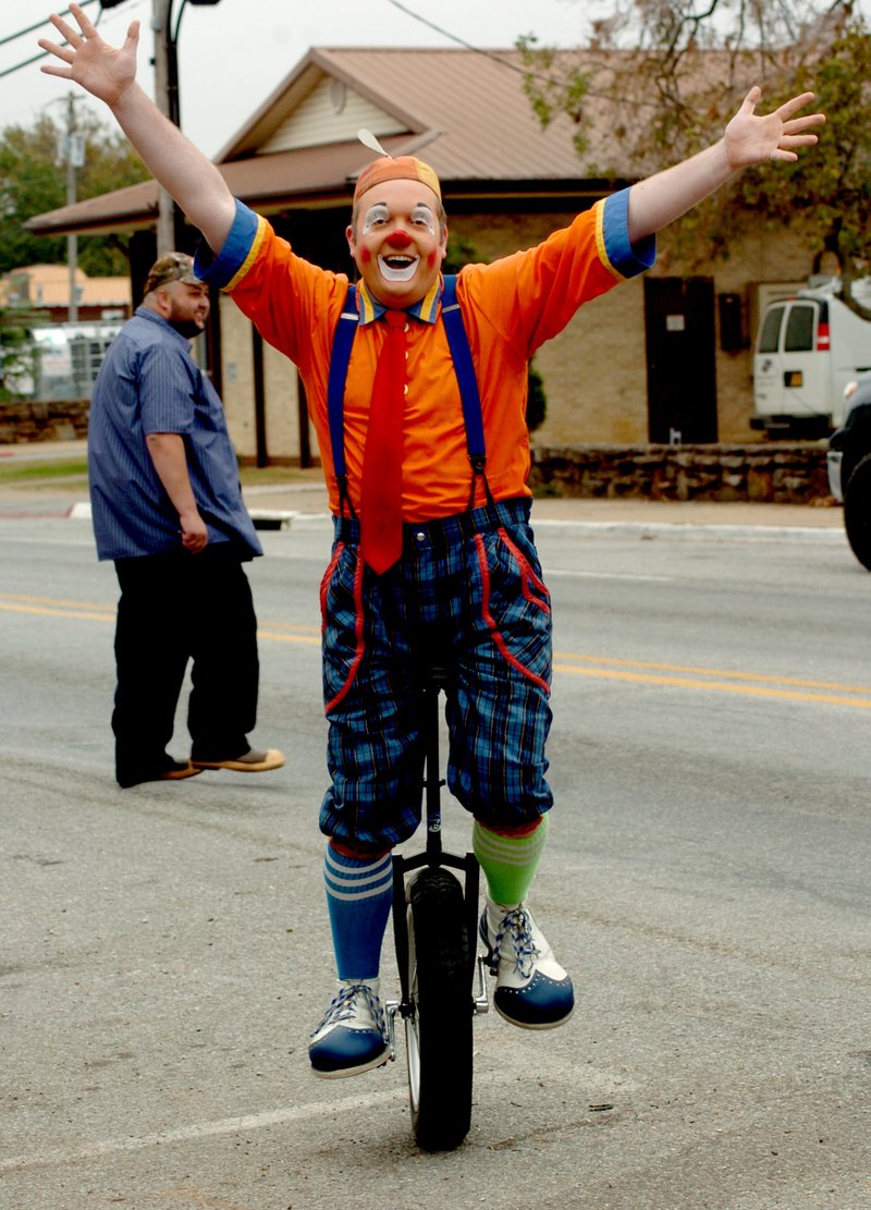 Photo by Mike Eckels
Melvino the clown rides his unicycle in front of the Gallery Cafe on Main St. in Decatur Oct. 5. Melvino was part of the advance team for the Kelly Miller Circus which will be in Decatur Oct. 19 at Veterans Park for two big performances.
