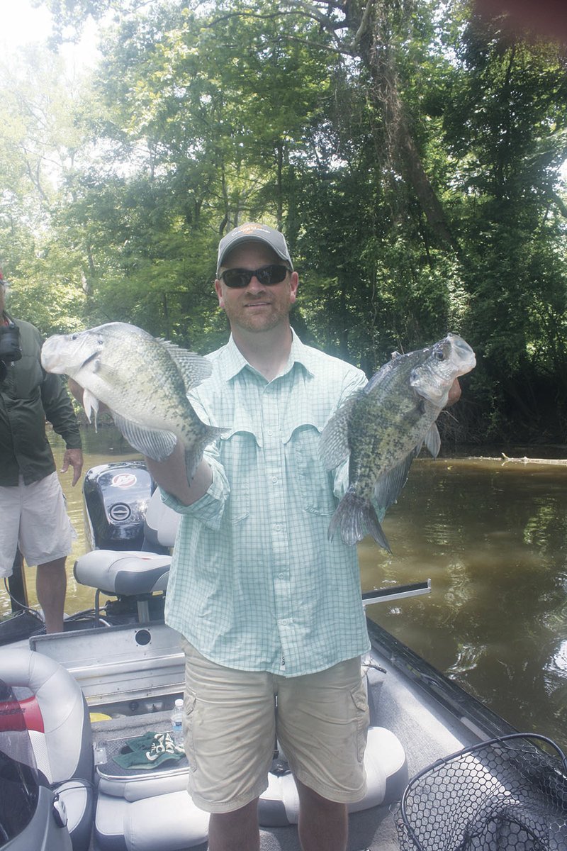 Jeff Smith, owner of Leland’s Lures, the Searcy-based company that produces baits such as the Trout Magnet and Crappie Magnet, holds up a pair of sizable white crappie pulled from his White River oxbow lake using his company’s baits.