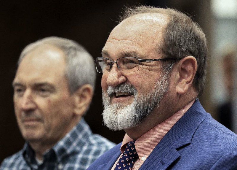 Tony Wood and Pulaski County Special district Superintendent Jerry Guess (right) address the Arkansas Board of Education on the agreement seperating Jacksonville schools from the Pulaski County Special School District to form the new Jacksonville/North Pulaski School District. 