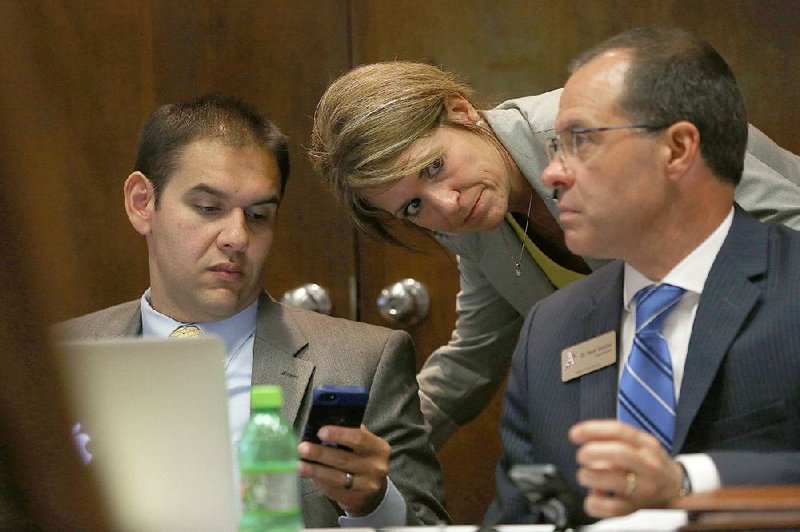 Mark Gotcher (right),  the Education Department’s deputy commissioner is shown with ADE Assistant Commissioner of Learning Services Dr. Debbie Jones, center, and Mike Hernandez, Deputy Commissioner for Arkansas Department of Education, left, in this file photo.