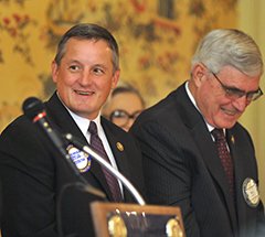 The Sentinel-Record/Mara Kuhn ROTARY GUEST: U.S. Rep. Bruce Westerman, R-District 4, left, and state Sen. Bill Sample, R-District 14, enjoy a laugh on the dais during the Hot Springs National Park Rotary Club's weekly meeting at the Arlington Resort Hotel & Spa on Wednesday. Westerman addressed the succession crisis caused by John Boehner resigning as speaker of the House.