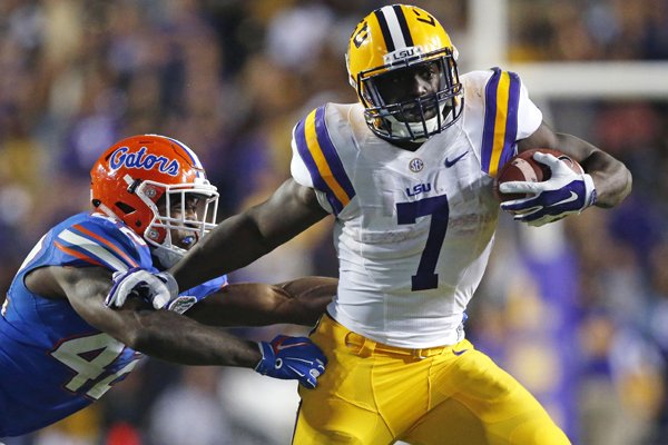 LSU running back Leonard Fournette (7) carries against Florida defensive back Keanu Neal (42) in the second half of an NCAA college football game in Baton Rouge, La., Saturday, Oct. 17, 2015. LSU won 35-28. (AP Photo/Gerald Herbert)