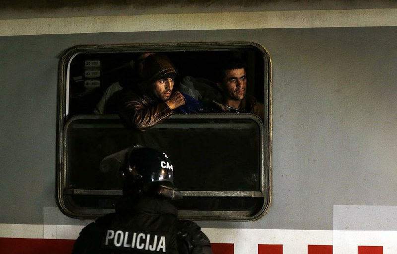 A train carrying hundreds of migrants diverted by Croatia arrives early Saturday at the rail station in Sredisce ob Dravi in northeastern Slovenia. Most were taken to the Austrian border later in the day. 